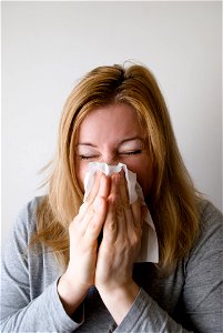 Woman Blowing Nose photo