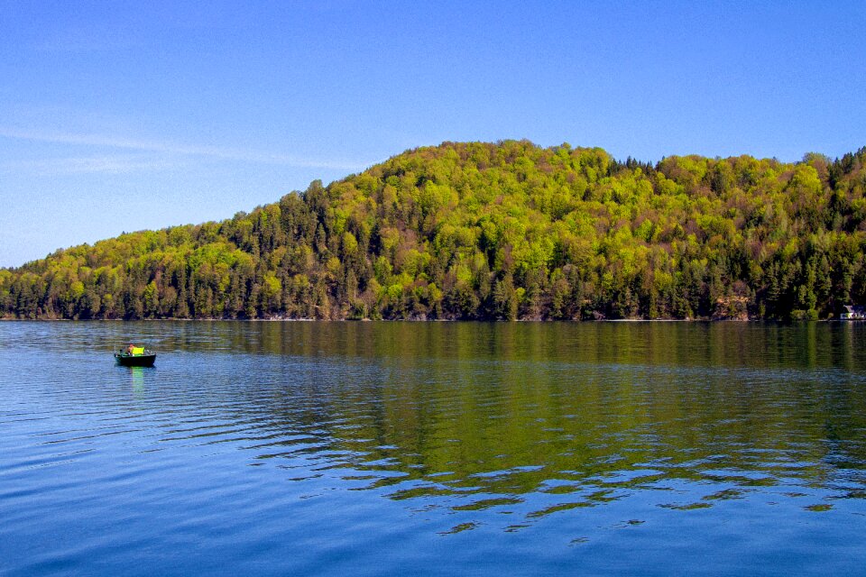 Blue sky fishing boat fuschlsee