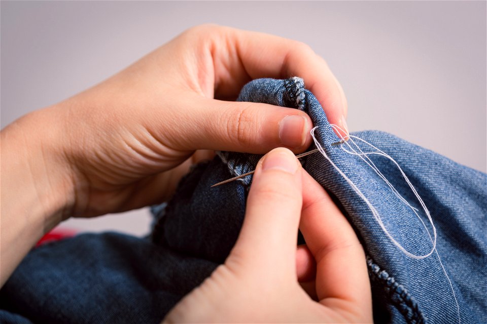 Hands Sewing Needle