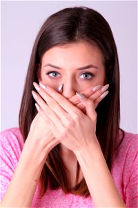 Woman Covered Mouth photo