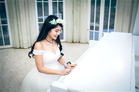 Bride Playing Piano photo
