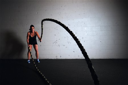 Woman Work Out Battle Ropes photo
