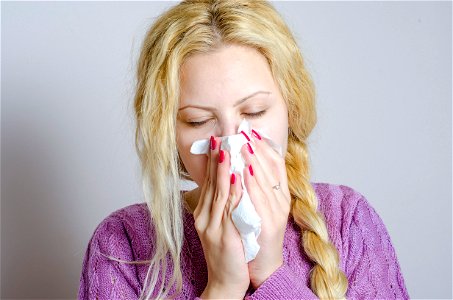 Woman Blowing Nose photo