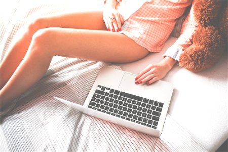 Woman Legs Laptop Computer photo