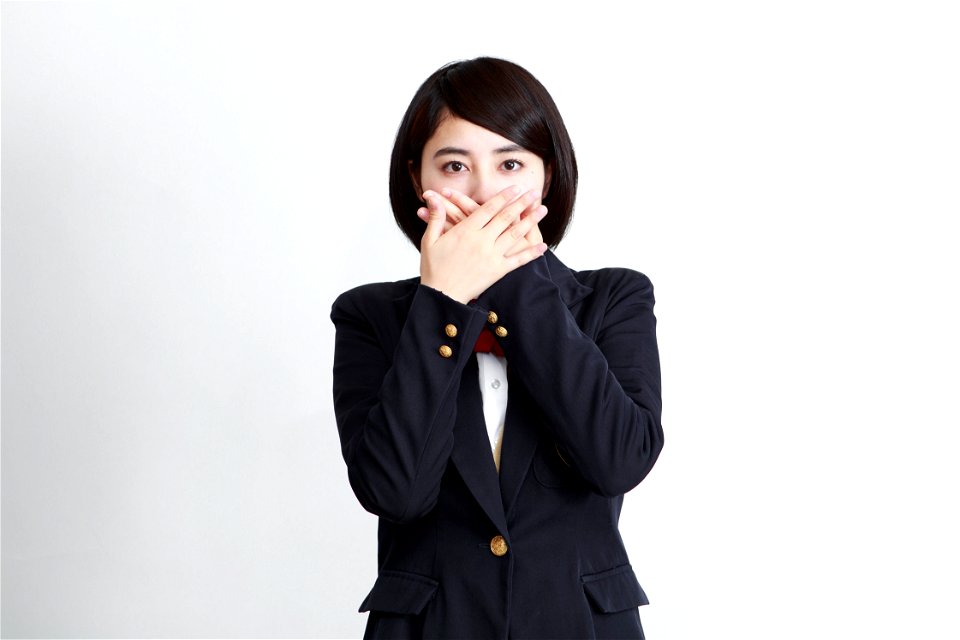 Female Student Cover Mouth photo