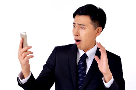 Business Man Smartphone Shocked photo