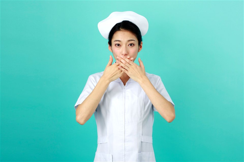 Woman Nurse Cover Mouth photo