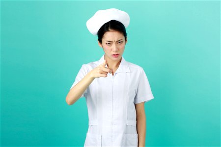 Woman Nurse Angry photo