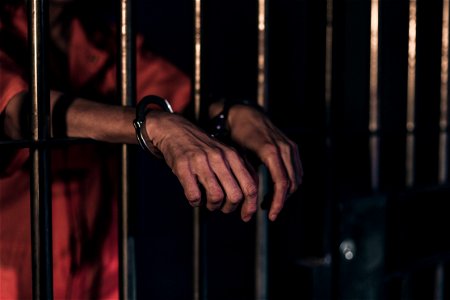 Hands Handcuffs Prison Cell photo
