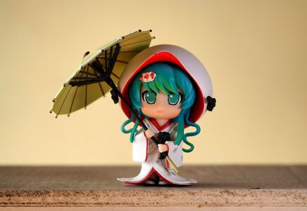 Female umbrella toy photo