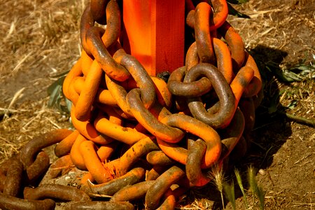 Rusty orange links of the chain