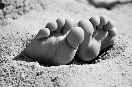 Dig in beach barefoot photo