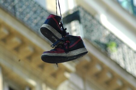 Shoes hanging shoe laces photo