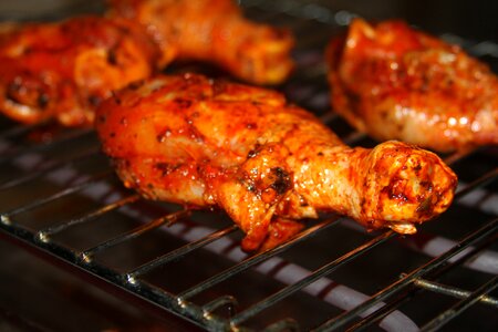 Barbecue grilling chicken thigh photo