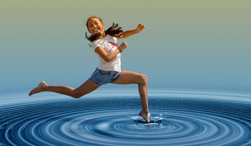 Woman jump water photo