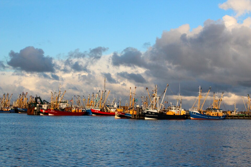 Fishing vessels clouds sea