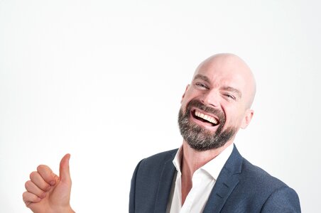 Smiling bold suit