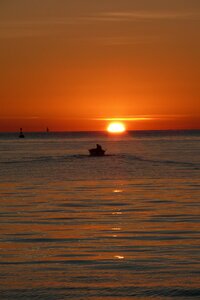 Fisherman sunset sea