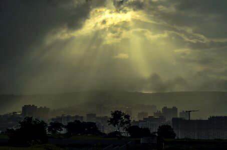 Cityscape sun rays blessings photo