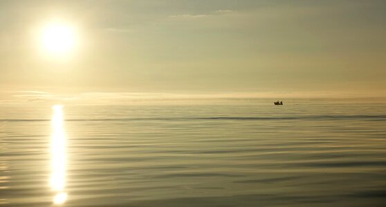 Sea boat sun photo