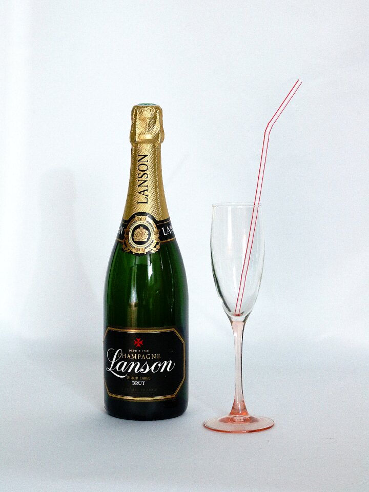 Glass champagne straw alcohol at the straw