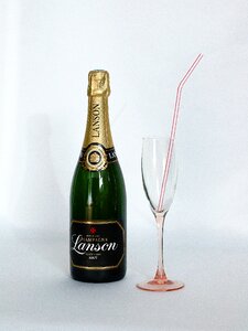 Glass champagne straw alcohol at the straw
