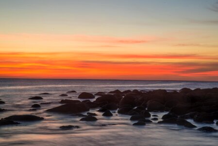 Sunrise rocks ocean photo