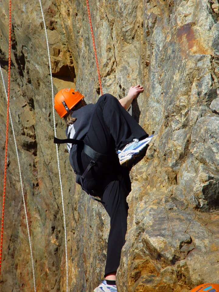 Climber climbing man