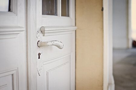Old white door handle photo