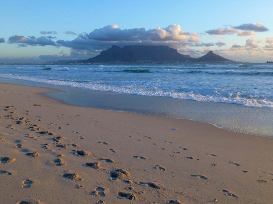 Tracks in the sand footprints in the sand ocean