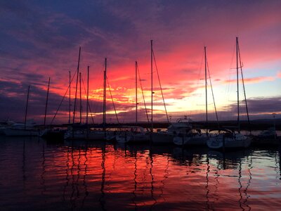 Sea boats sunset photo