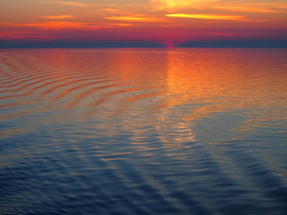 Wave afterglow setting sun