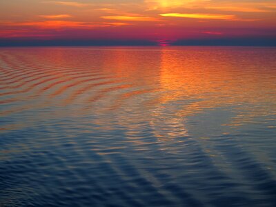 Wave afterglow setting sun