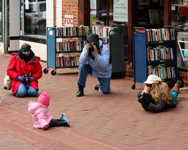 Baby shooting cameras photo