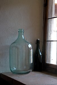 Window sill wine bottle deco photo