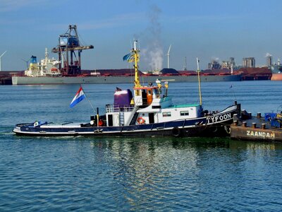 Tugboat pushing ships
