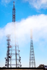 Mountains clouds poles transmitters