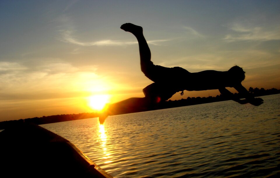 Silhouette jump water