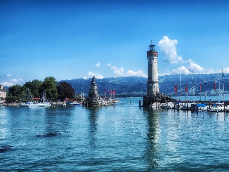 Lighthouse mountains boats