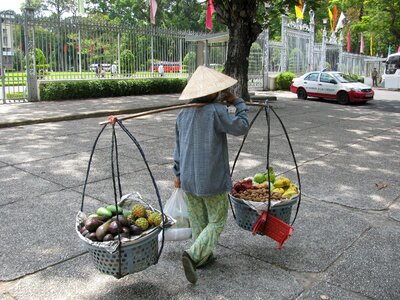 Carrying fruit baskets balanced