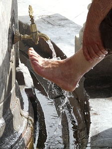 Washing feet islam water