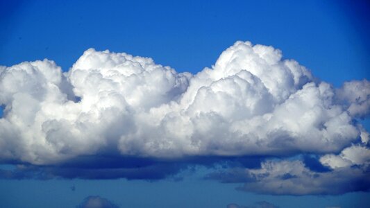 White cumulus clouds form photo