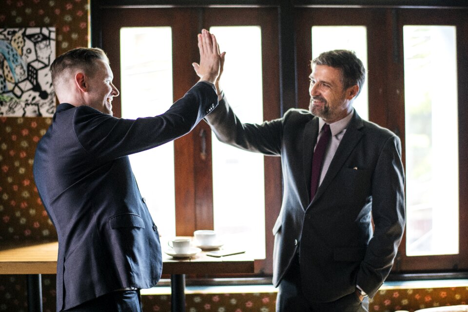 Businessmen high five