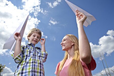 Mother son paper airplane photo