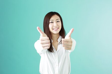 Business woman thumbs up photo