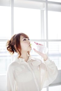 Woman girl drinking water photo