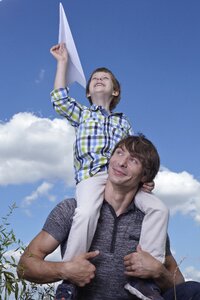 Father son paper airplane photo