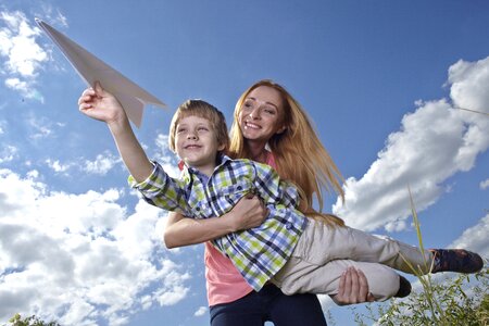 Mother son paper airplane photo