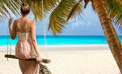 Beach sea woman swing photo