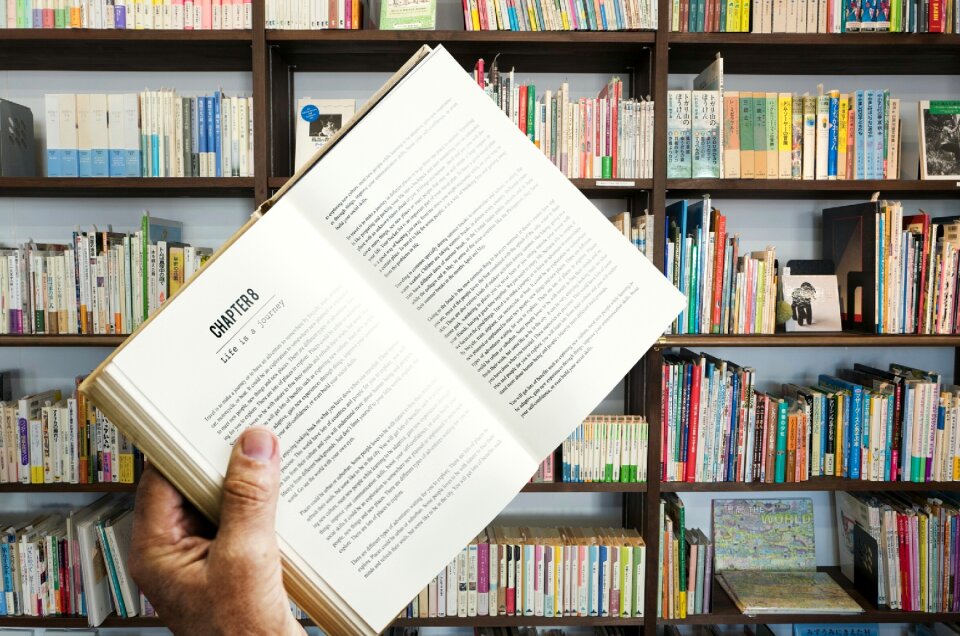 Book hand bookshelf